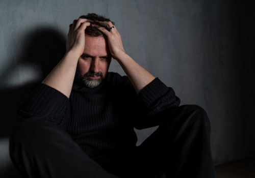 mental health in the workplace - picture of a stressed looking man
