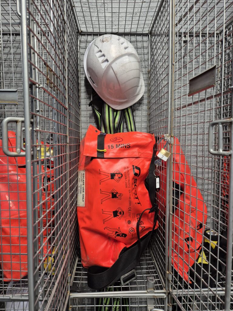 Imge of PPE safety gear in a wire mesh locker at SA Safety